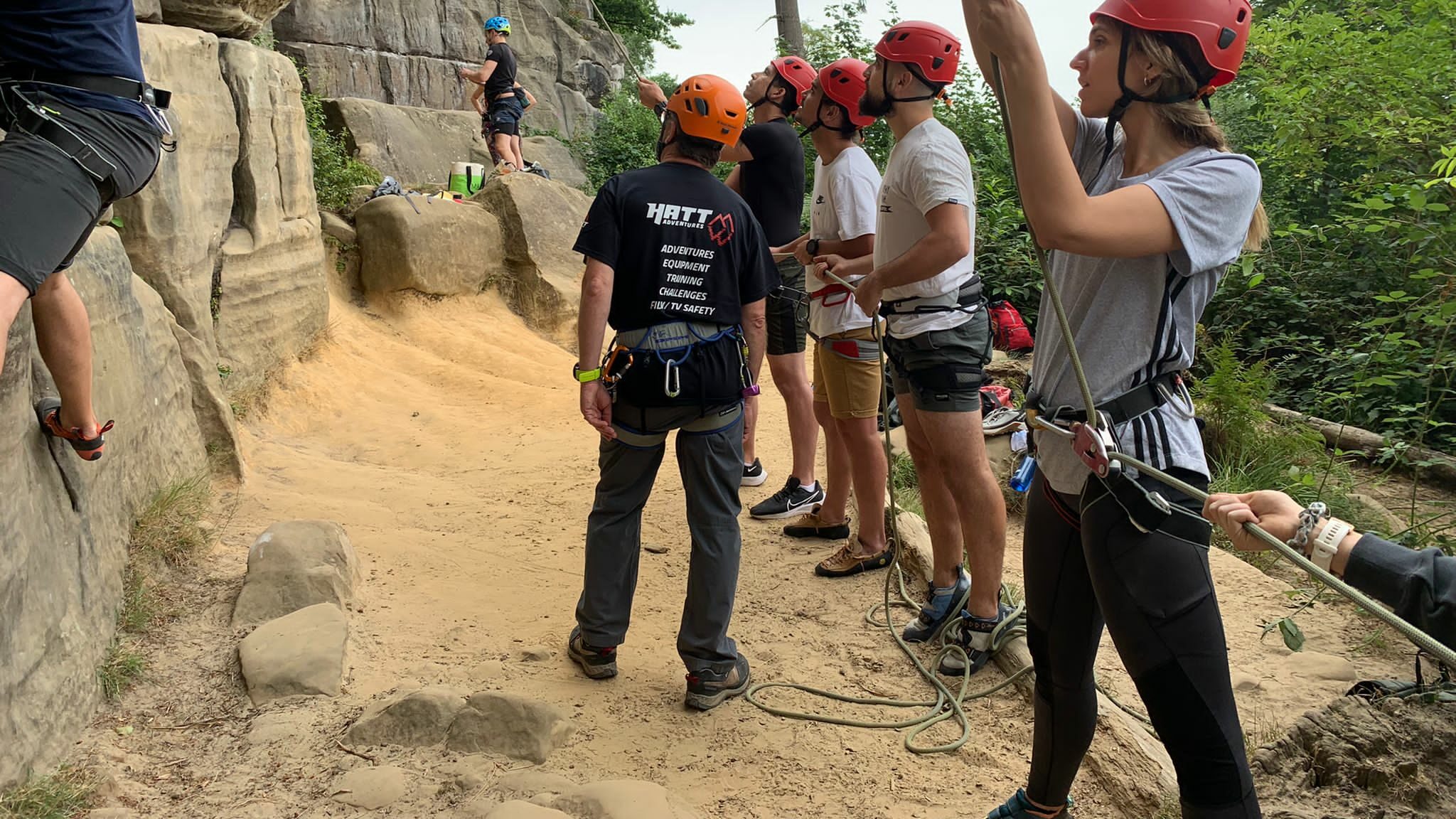 Ropes being used with a group on the sandy floor at Harrison's rocks.