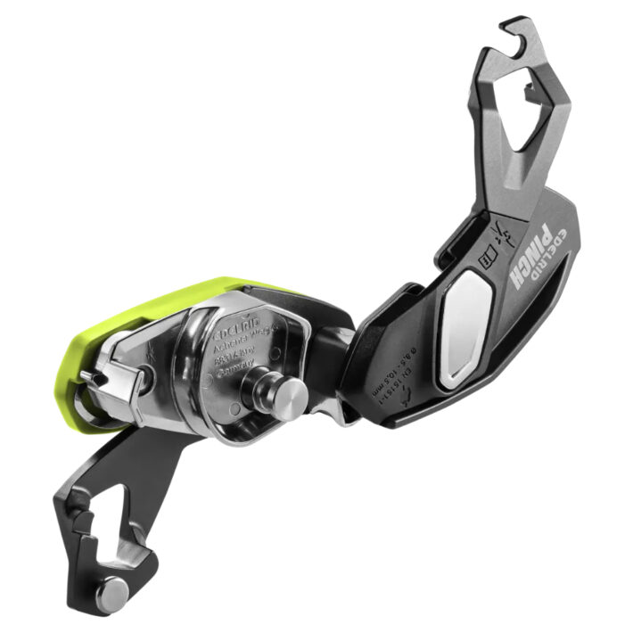 A photo of the Edelrid Pinch Assisted braking device, not in use but opened to expose the inner mechanism and on a white background