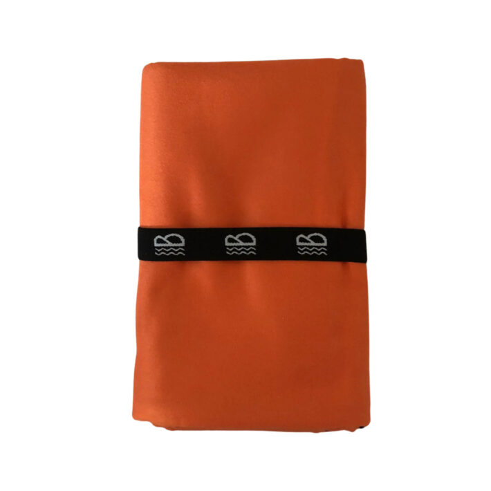 front image of an orange towel folded on a white background